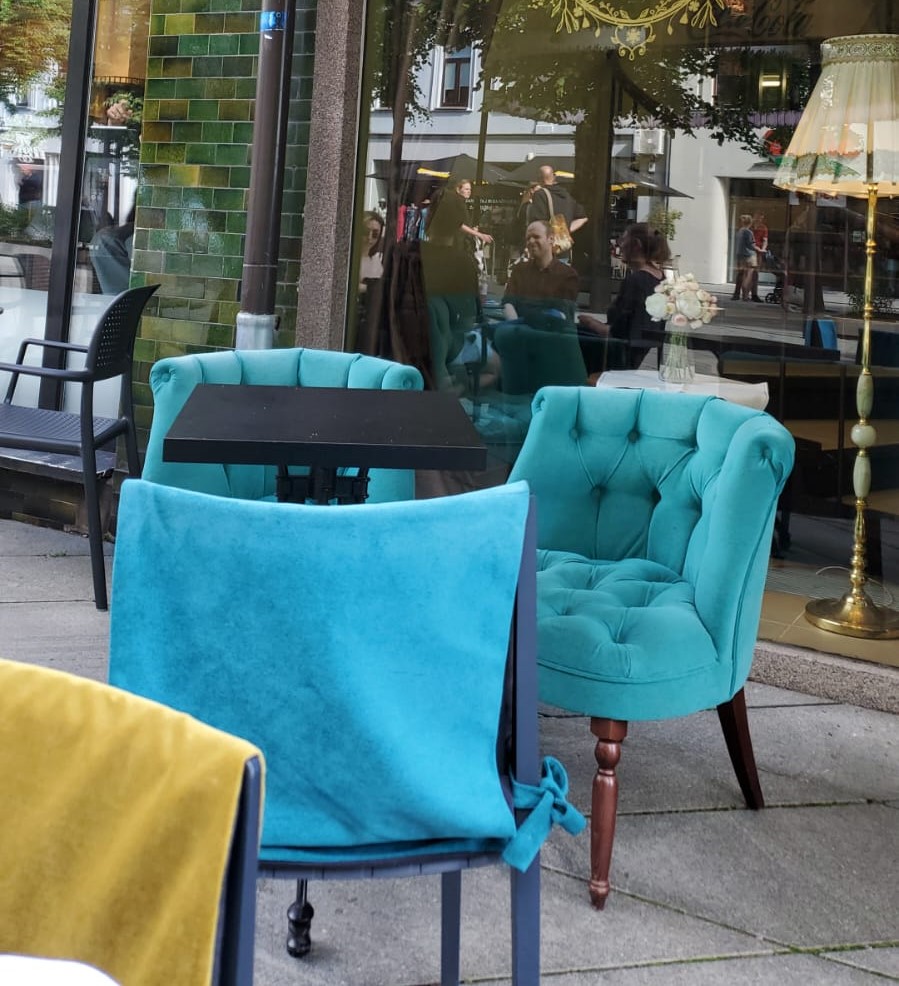 turquoise chairs at a cafe